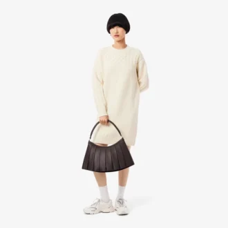 Damegenser i ull med patchwork-effekt