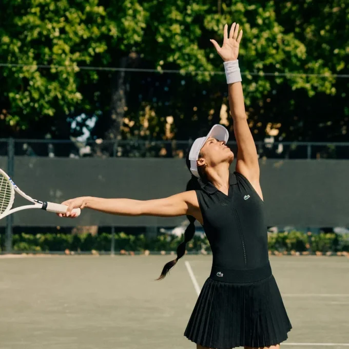 Ermeløs tennis-poloskjorte i stretchstrikk for damer