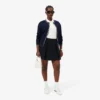 L.12.D ribbet bomullspolo i slim fit for kvinner