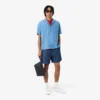Lacoste Club clutch i kornet skinn