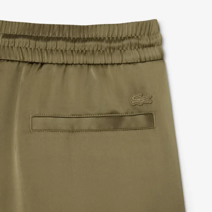 Oversized joggebukse i sateng for kvinner
