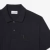 Petit Piqua-polo med klassisk passform og broderidetaljer