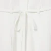Runway-pologenser med plissering og broderidetaljer