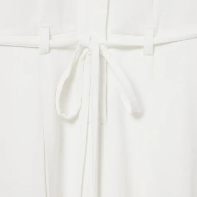 Runway-pologenser med plissering og broderidetaljer