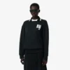 Runway-pologensere med krage og badge-detalj