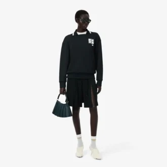 Runway-pologensere med krage og badge-detalj