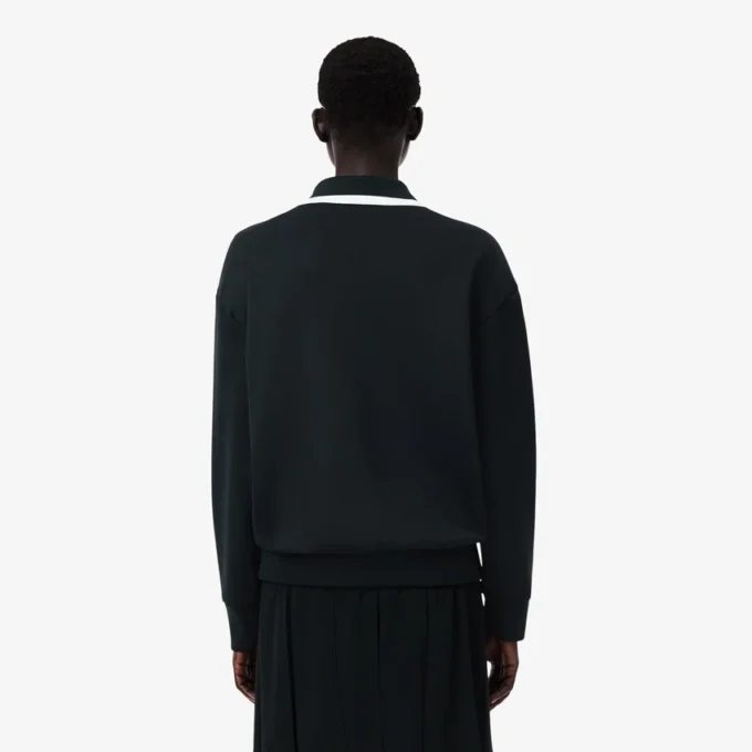Runway-pologensere med krage og badge-detalj