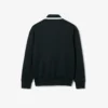 Runway-pologensere med krage og badge-detalj