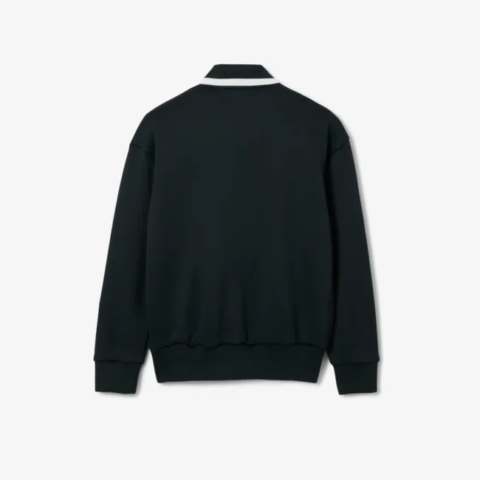 Runway-pologensere med krage og badge-detalj