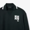 Runway-pologensere med krage og badge-detalj