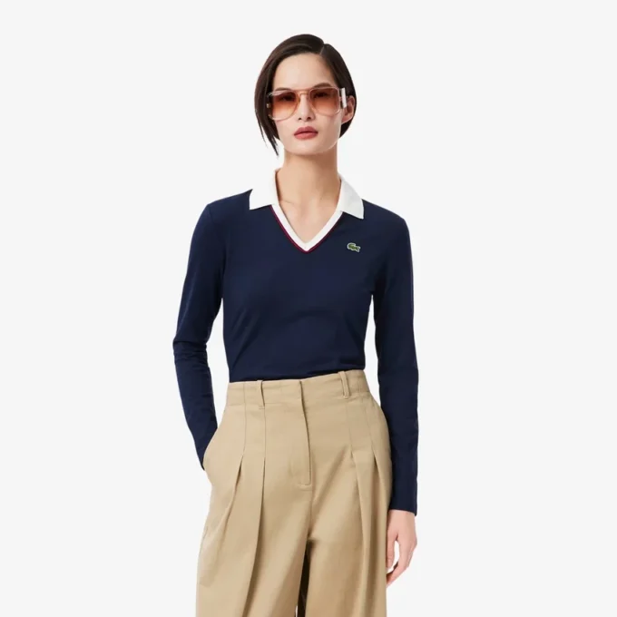 Slim fit-pologensere med detaljer og lange ermer for kvinner