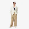 Slim fit-pologensere med detaljer og lange ermer for kvinner