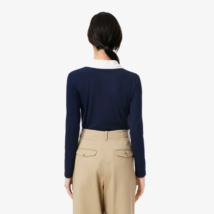 Slim fit-pologensere med detaljer og lange ermer for kvinner