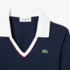 Slim fit-pologensere med detaljer og lange ermer for kvinner