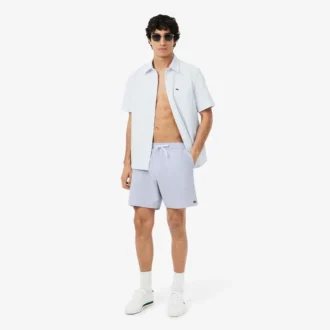 Stripete badetrunks i mellomlengde med struktur for menn