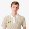 Termoregulerende stripet golfpolo for menn