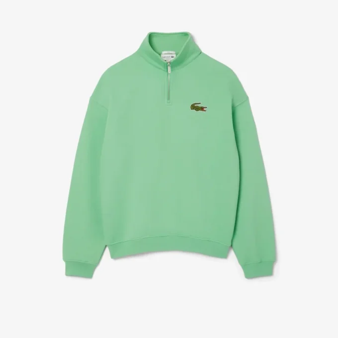 Unisex-sweatshirt med løs passform, badge-detaljer og halv glidelås