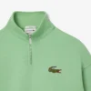 Unisex-sweatshirt med løs passform, badge-detaljer og halv glidelås