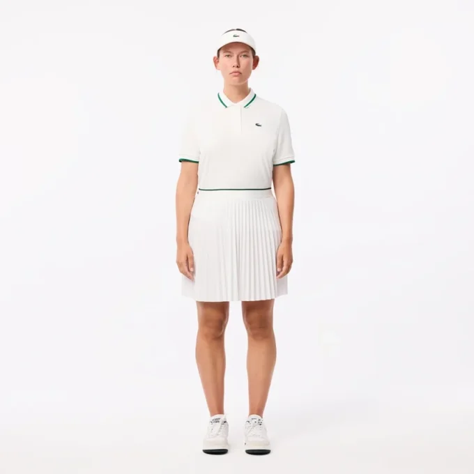 Uv-beskyttende tennis-pologensere med stripet krage for kvinner