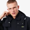 Vannavvisende parkas med hette i mellomlengde for menn